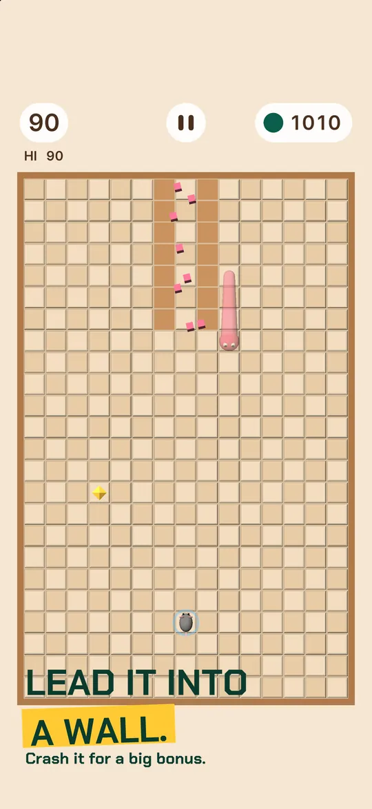 Caption: LEAD IT INTO A WALL. Crash it for a big bonus. The snake hits a wall and the score jumps by 90.